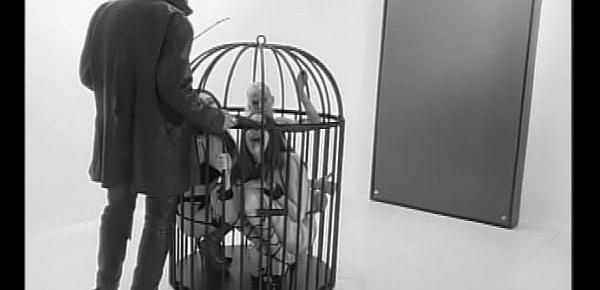  Muscular guys humiliate two cute young chicks and fuck them in a cage